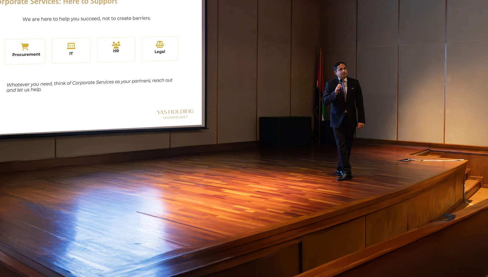 Zahaib Nabeel presenting Corporate Services to Yas Holding Technology staff, with a slide covering procurement, IT, HR and legal shown on screen